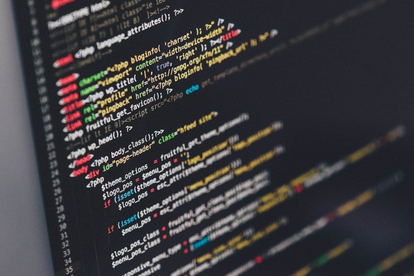 Software developer writing code on screen